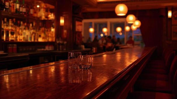 グラスが置かれているバーのカウンターの写真