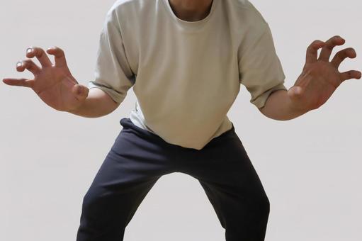 両手を前に出して構える男性のポーズ 両手を前に出して構える男性のポーズ 男性,ポーズ,威嚇の写真素材