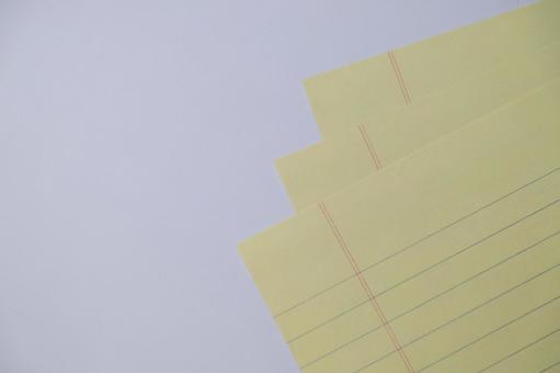黄色いノート用紙のクローズアップ 黄色いノート用紙のクローズアップ ノート,紙,黄色の写真素材