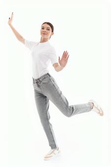 A woman posing on one leg and looking at the camera, JPG
