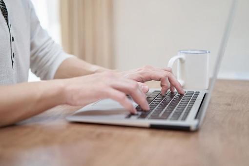 At hand when typing on a laptop, JPG At hand when typing on a laptop, JPG