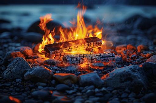 焚き火の薪と炎が灯るキャンプの夜 焚き火の薪と炎が灯るキャンプの夜 焚き火,炎,薪の写真素材