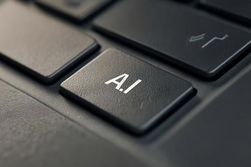 ノートパソコンのAIボタンとテクノロジーの写真