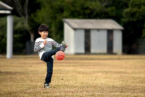 <Material> Boys playing soccer energetically in the park, JPG