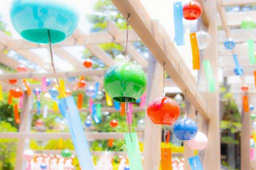 A light scene of wind chimes swaying in the wind, JPG