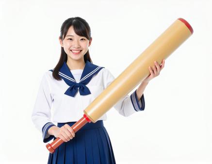 大きな棒を持っている女子生徒のイメージ 大きな棒を持っている女子生徒のイメージの写真