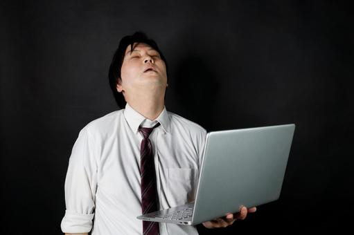 疲れたサラリーマン男性 疲れたサラリーマン男性の写真