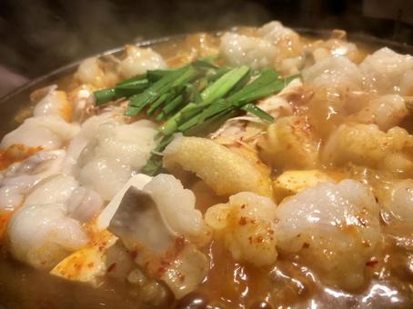 湯気の向こうの赤もつ鍋 もつ鍋,鍋料理,居酒屋の写真素材