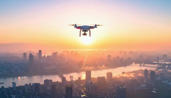 都市上空を飛行するドローン 都市上空を飛行するドローンの写真