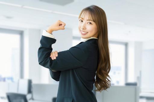 ガッツポーズをする女性・ビジネスウーマン 女性,ガッツポーズ,笑顔の写真素材