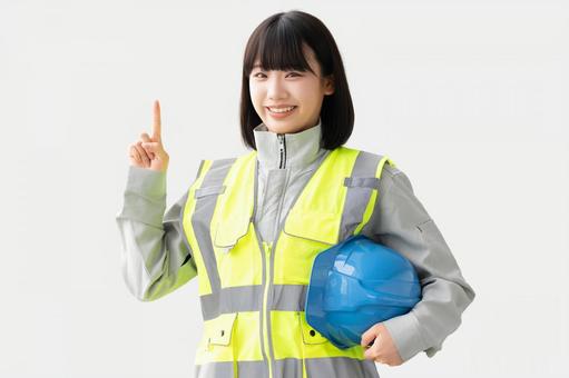 反射ベストと作業服を着た笑顔の女性 女性,ビジネス,作業服の写真素材