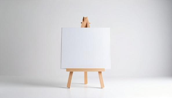 イーゼルと空白のキャンバス イーゼルと空白のキャンバスの写真