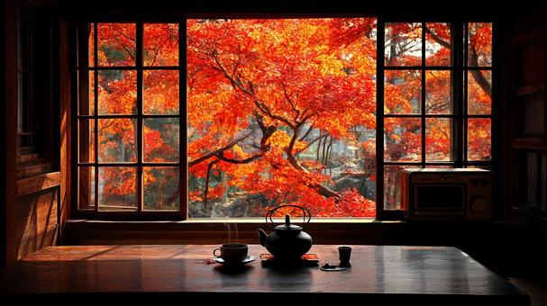 窓に広がる鮮やかな紅葉の景色の写真