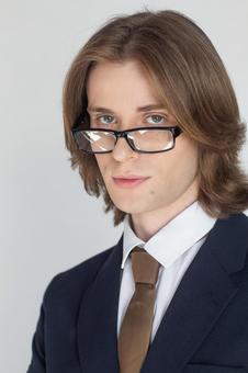 ずらしたメガネのスーツを着た男性 男性,外国人,欧米人の写真素材