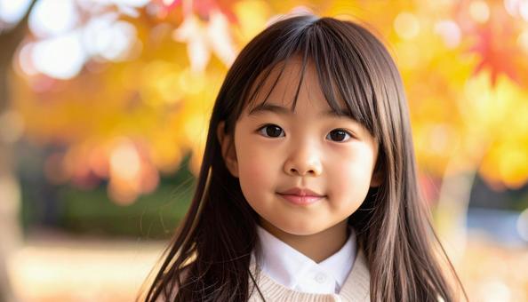 可愛い少女のポートレート 紅葉の背景 可愛い少女のポートレート 紅葉の背景の写真