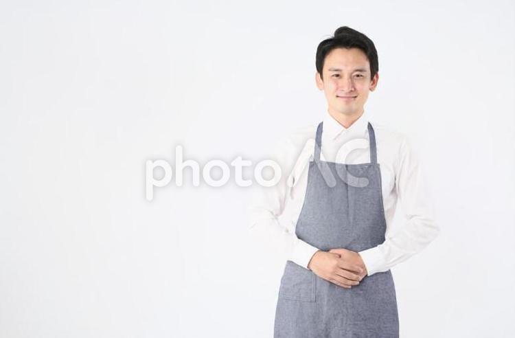 エプロンをつけた男性 飲食店,スタッフ,店員の写真素材