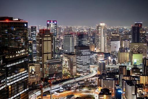 高層ビル群と光り輝く大阪梅田の夜景ビュー 高層ビル群と光り輝く大阪梅田の夜景ビュー 夜景,大阪,夜の写真素材