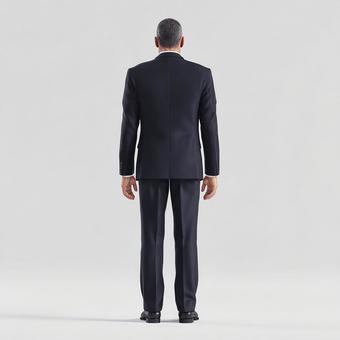 洗練されたスタイル：静かに立つ男性の背面の写真