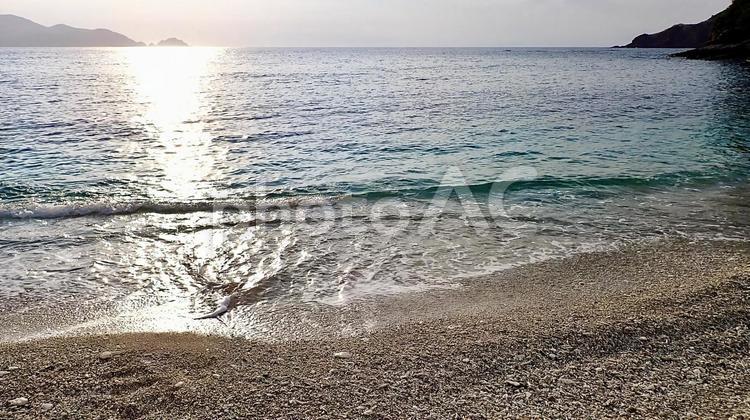 阿嘉島の夕方のヒズシビーチの波打ち際 ヒズシ,ビーチ,波打ち際の写真素材