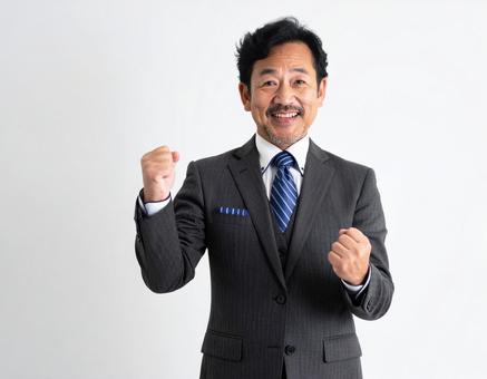 ガッツポーズのビジネスマン ガッツポーズのビジネスマンの写真