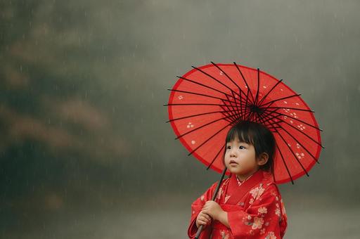 雨の中で和傘を持つ着物の少女 雨の中で和傘を持つ着物の少女の写真