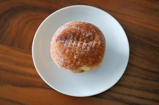 とろけるカスタードの雪化粧ドーナツ マラサダ,揚げドーナツ,砂糖の写真素材