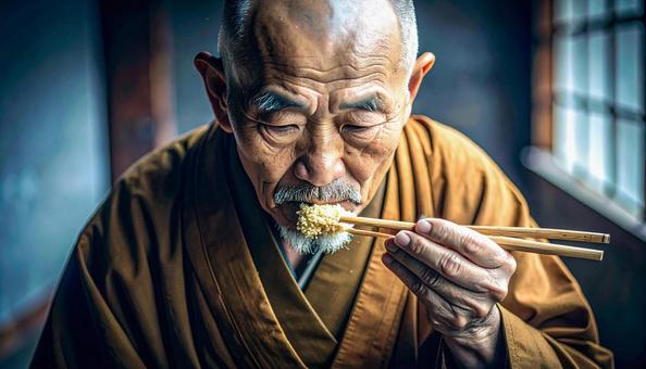 精進料理を食べる老いた僧侶 精進料理を食べる老いた僧侶の写真