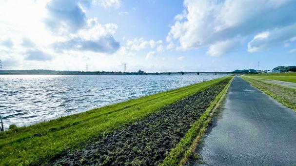 遠賀川の広々とした河川敷 遠賀川の広々とした河川敷 河川敷,遠賀川,草原の写真素材