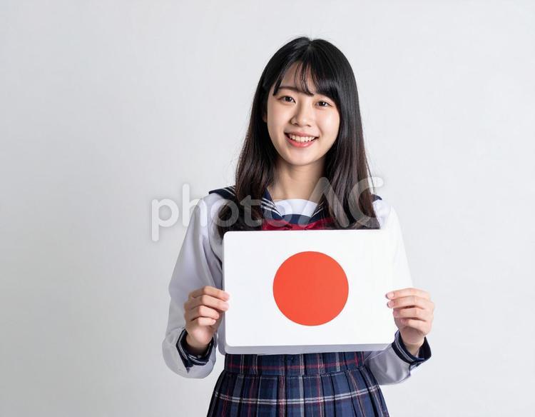 日の丸の国旗を持った女子生徒のイメージ 国旗,日の丸,女の子の写真素材