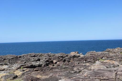 Photo, rocky field, blue, sea surface, 