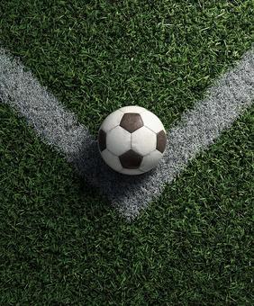 緑のピッチに映えるサッカーボール 緑のピッチに映えるサッカーボールの写真
