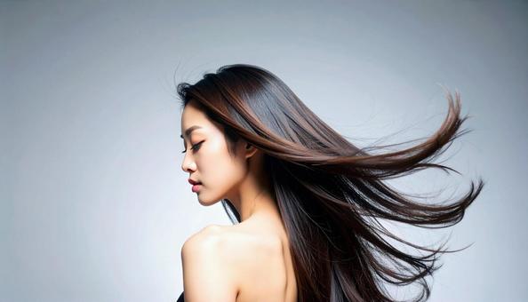 うつむいているヘアモデルの日本人女性 うつむいているヘアモデルの日本人女性の写真