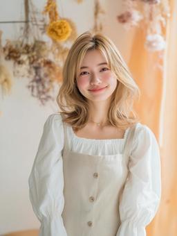 ガーリーな女の子モデル、かわいい花の背景の写真