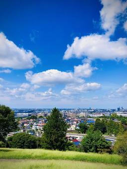 真夏の多摩市の遠景3(縦型) 真夏の多摩市の遠景3(縦型) 夏空,青空,雲の写真素材