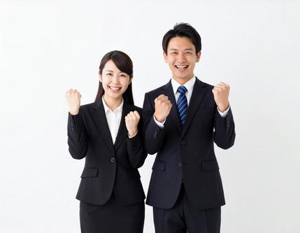 ガッツポーズする若手男女ビジネスマン ガッツポーズする若手男女ビジネスマンの写真