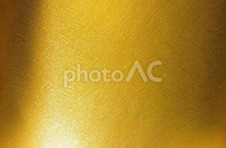 細かいでこぼこの質感のある金色の背景素材 テクスチャ,背景,金色の写真素材