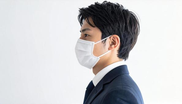 マスクをつける人 マスクをつける人の写真