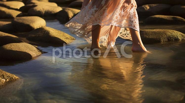 レースのドレスと水辺の足元・裸足・繊細 女性,足元,水辺の写真素材
