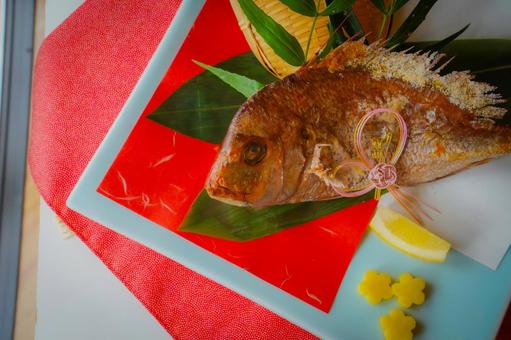 Grilled sea bream and celebratory decorations, JPG