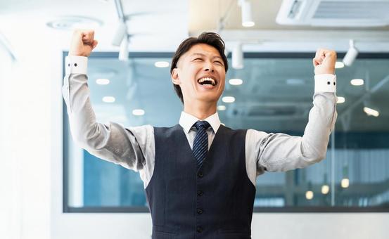 Male businessman happy with a fist pump, JPG