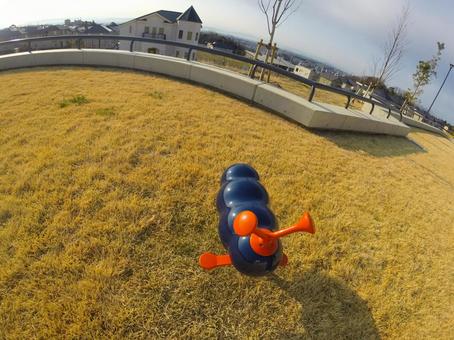 Blue sky and playground equipment in the field, JPG