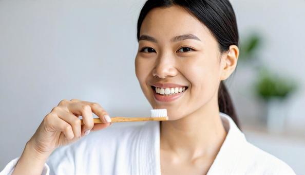 歯磨きする女性 歯磨きする女性の写真