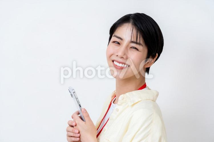 スマホを使うビジネスパーソン。 ビジネス,女性,ビジネスウーマンの写真素材