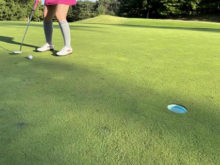 パッティングの瞬間 ゴルフ,パター,パッティングの写真素材