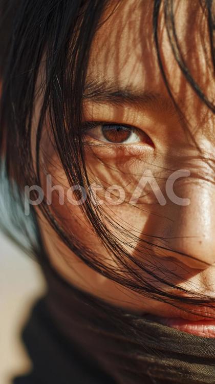 風を受ける女性の顔のアップショット 女性,顔,風の写真素材
