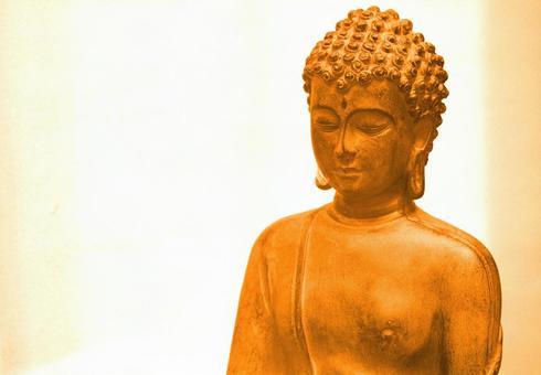 落ち着く穏やかな顔の仏像の石像イメージ 落ち着く穏やかな顔の仏像の石像イメージの写真