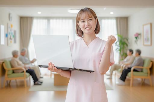 介護系スタッフとPC 介護系スタッフとPC 介護士,看護師,医療の写真素材