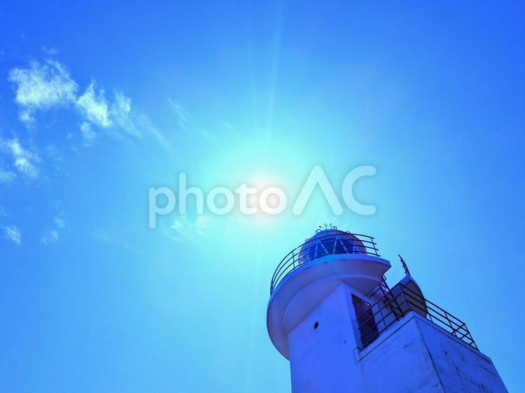 灯台と空と太陽のアート 灯台,太陽,青空の写真素材