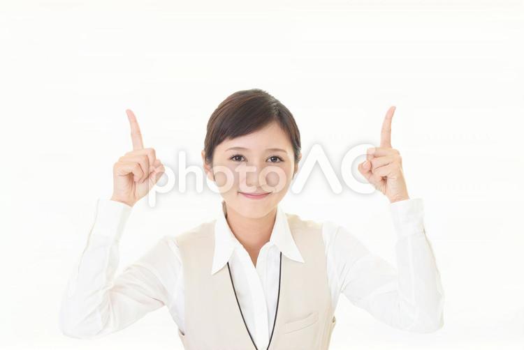 指示する笑顔のビジネスウーマン 女性,ビジネスウーマン,女の写真素材