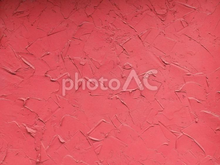 赤色のコテ跡のあるコンクリートの壁 赤色,朱赤色,レッドの写真素材